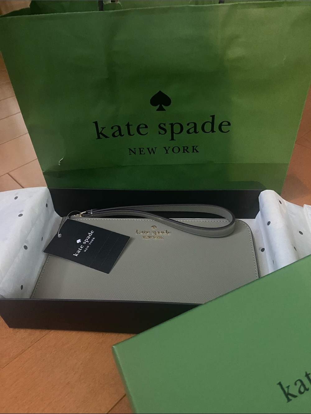 kate spade Light Gray Saffiano Wristlet with Gold Logo